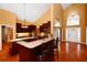 Updated kitchen with granite counters, stainless appliances, a breakfast bar, and plenty of cabinet space at 682 Ferncliff Dr, Port Orange, FL 32127