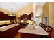 Bright kitchen with stainless appliances, granite countertops, breakfast bar seating, and hardwood floors at 682 Ferncliff Dr, Port Orange, FL 32127