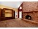 Living room with a brick fireplace and rustic, decorative touches at 682 Ferncliff Dr, Port Orange, FL 32127