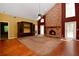 Spacious living room featuring a brick fireplace and built in shelving at 682 Ferncliff Dr, Port Orange, FL 32127