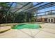 Enclosed swimming pool with spa and waterfall features and view of the home at 682 Ferncliff Dr, Port Orange, FL 32127