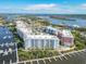 Beautiful aerial view of the waterfront community with buildings, boat docks and access to the river and ocean at 7 Riverwalk Dr # 205, New Smyrna Beach, FL 32169