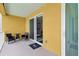 Cozy outdoor balcony offers comfortable seating and a relaxing space at 7 Riverwalk Dr # 205, New Smyrna Beach, FL 32169