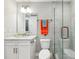 Bright bathroom featuring granite countertops and glass-enclosed shower at 7 Riverwalk Dr # 205, New Smyrna Beach, FL 32169