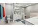Bright bathroom featuring neutral tones, a double sink, and a glass-door shower at 7 Riverwalk Dr # 205, New Smyrna Beach, FL 32169