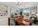 Inviting dining area blends seamlessly into the living space, highlighted by open balcony views, and stylish furniture at 7 Riverwalk Dr # 205, New Smyrna Beach, FL 32169