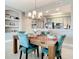 Open concept dining room showcasing a wood table and chairs next to the kitchen at 7 Riverwalk Dr # 205, New Smyrna Beach, FL 32169