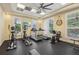 Workout area featuring treadmills, elliptical machines, stationary bike and large windows with natural light at 7 Riverwalk Dr # 205, New Smyrna Beach, FL 32169