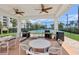 Community grilling area with multiple BBQ grills and seating, next to the tennis courts at 7 Riverwalk Dr # 205, New Smyrna Beach, FL 32169