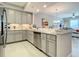 Modern kitchen with stainless steel appliances and plenty of countertop space for meal preparation at 7 Riverwalk Dr # 205, New Smyrna Beach, FL 32169