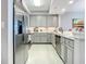 Well-appointed kitchen with modern appliances, sleek cabinets, and ample counter space at 7 Riverwalk Dr # 205, New Smyrna Beach, FL 32169