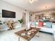 Inviting open concept living room featuring modern décor and an adjacent kitchen area at 7 Riverwalk Dr # 205, New Smyrna Beach, FL 32169
