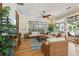 Lounge area with comfortable seating, decorative pillows, and a tropical-themed decor at 7 Riverwalk Dr # 205, New Smyrna Beach, FL 32169