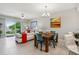 Open floor plan combines a stylish living area, dining space, and an access to the balcony, with modern finishes at 7 Riverwalk Dr # 205, New Smyrna Beach, FL 32169