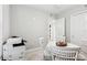 Neutral office with a white table and chairs, a printer, and a peek into the hallway at 7 Riverwalk Dr # 205, New Smyrna Beach, FL 32169