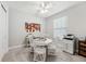 Bright office with a modern ceiling fan, art piece, white table and chairs, and a large printer at 7 Riverwalk Dr # 205, New Smyrna Beach, FL 32169