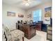 Office space featuring multiple desks, decor, and light-filled window at 7 Riverwalk Dr # 205, New Smyrna Beach, FL 32169