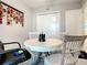 Functional office space with a round table, chairs and views of a closet and doorway at 7 Riverwalk Dr # 205, New Smyrna Beach, FL 32169
