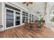 Covered patio area featuring tile flooring and a dining table with seating for community residents at 7 Riverwalk Dr # 205, New Smyrna Beach, FL 32169