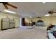 Spacious basement featuring carpeted flooring and ample room for recreation and storage at 706 S Timberlane Dr, New Smyrna Beach, FL 32168