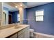 Bathroom with a vanity, sink, mirror, toilet, window, and hardwood floors under recessed lighting at 706 S Timberlane Dr, New Smyrna Beach, FL 32168