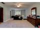 Bedroom with carpet, ceiling fan, two beds, and a window with nature view at 706 S Timberlane Dr, New Smyrna Beach, FL 32168