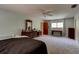 Spacious bedroom with ceiling fan, light blue walls, and large dresser with mirror at 706 S Timberlane Dr, New Smyrna Beach, FL 32168