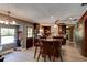 Bright and airy kitchen with island, breakfast bar, wood cabinetry, and stainless steel appliances at 706 S Timberlane Dr, New Smyrna Beach, FL 32168