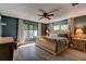 Serene main bedroom with a large window, stylish furnishings, and ample natural light at 706 S Timberlane Dr, New Smyrna Beach, FL 32168