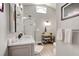 Bathroom features a marble vanity, sleek fixtures, and a glass shower enclosure for a spa-like experience at 706 Sky Tree Ct, New Smyrna Beach, FL 32168