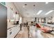 Modern kitchen featuring white cabinetry, granite countertops, stainless steel appliances, and a breakfast bar at 706 Sky Tree Ct, New Smyrna Beach, FL 32168