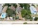 Single-story house featuring a well-maintained backyard with garden and lawn area at 825 E 23Rd Ave, New Smyrna Beach, FL 32169