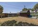 Backyard shed offers extra storage space and matches the home's exterior at 825 E 23Rd Ave, New Smyrna Beach, FL 32169