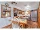 Charming eat-in kitchen with wood cabinetry and stainless steel appliances at 825 E 23Rd Ave, New Smyrna Beach, FL 32169
