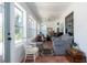 Bright sun room filled with natural light and comfortable seating at 825 E 23Rd Ave, New Smyrna Beach, FL 32169