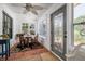 Cozy sun room with multiple windows and tile flooring at 825 E 23Rd Ave, New Smyrna Beach, FL 32169