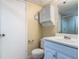 This bathroom offers a vanity with single sink, mirror and medicine cabinet at 95 Moonstone Ct, Port Orange, FL 32129