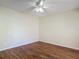 An airy bedroom with wood-look floors and a ceiling fan for added comfort at 95 Moonstone Ct, Port Orange, FL 32129