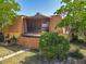 Two-story home with a screened in porch, wooden fence, lush landscaping, and blue sky at 95 Moonstone Ct, Port Orange, FL 32129