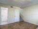 Hallway features hardwood style floors and access to the stairs and bathroom at 95 Moonstone Ct, Port Orange, FL 32129