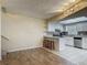 Open-concept layout featuring a bright kitchen with granite countertops and stainless steel appliances at 95 Moonstone Ct, Port Orange, FL 32129