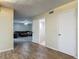 Spacious living room featuring wood floors and access to the bathroom and bonus living area at 95 Moonstone Ct, Port Orange, FL 32129
