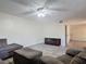 Spacious living room with a ceiling fan and ample seating with a view of other rooms in the home at 95 Moonstone Ct, Port Orange, FL 32129