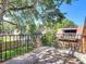 Outdoor patio exhibiting a metal railing and lush surrounding trees, offering a serene view at 95 Moonstone Ct, Port Orange, FL 32129