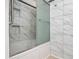 Luxurious shower with built in shelving and glass enclosure at 95 Moonstone Ct, Port Orange, FL 32129