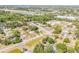 An expansive aerial view captures the home nestled among lush trees and a nearby cityscape at 995 16Th St, Edgewater, FL 32132