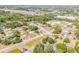 An expansive aerial view captures the home nestled among lush trees and a nearby cityscape at 995 16Th St, Edgewater, FL 32132