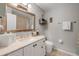 Bathroom featuring framed mirror, gray walls, tile floors, and updated vanity at 995 16Th St, Edgewater, FL 32132