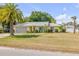Well-maintained single-story home with a large front yard and attached two-car garage at 995 16Th St, Edgewater, FL 32132