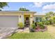Close up of front entrance, showing well manicured landscaping, showing front porch at 995 16Th St, Edgewater, FL 32132